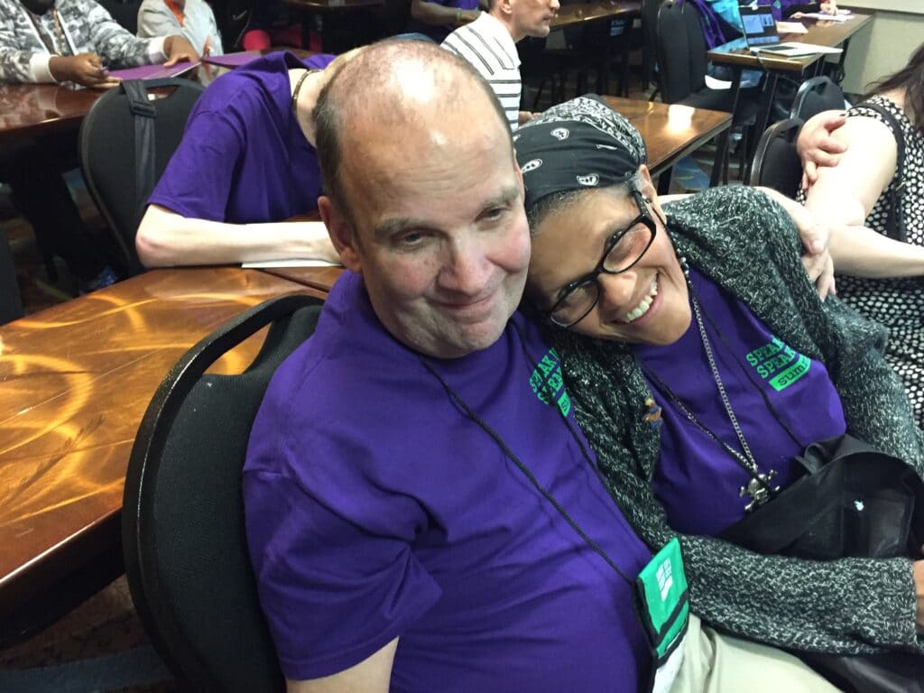 Photo of Marty with Gwen resting her head on his shoulder.