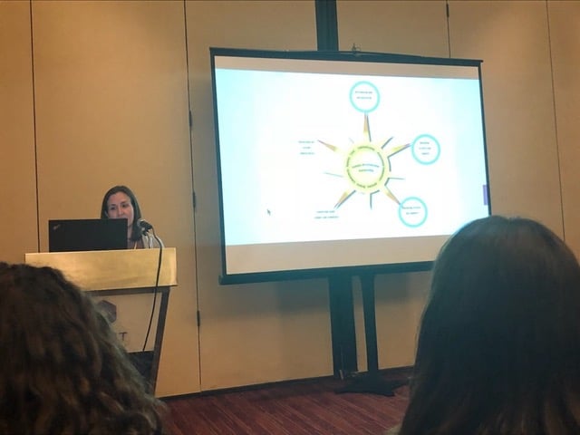 A woman giving a presentation