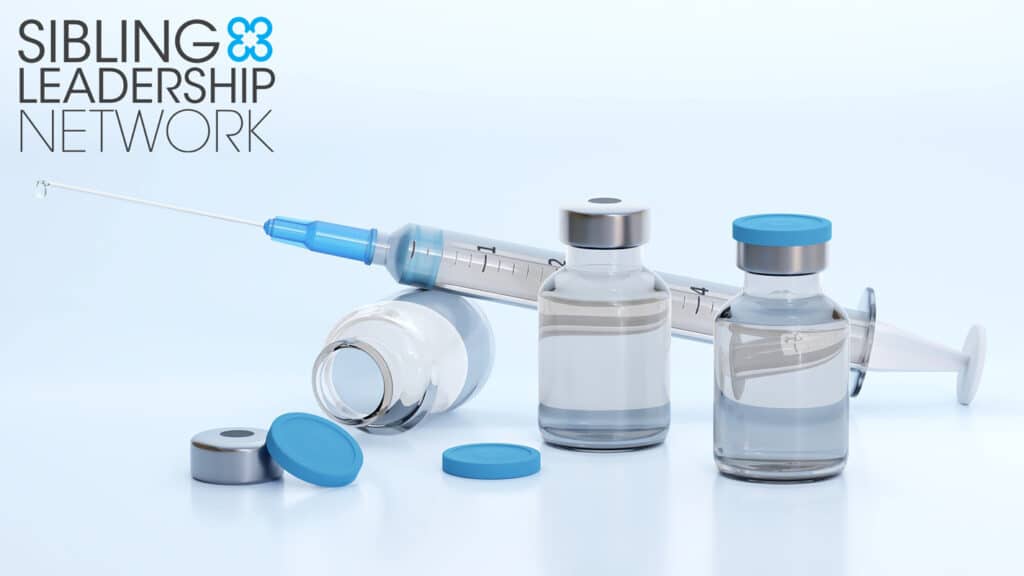 An image of a syringe and vaccine bottles with the SLN logo