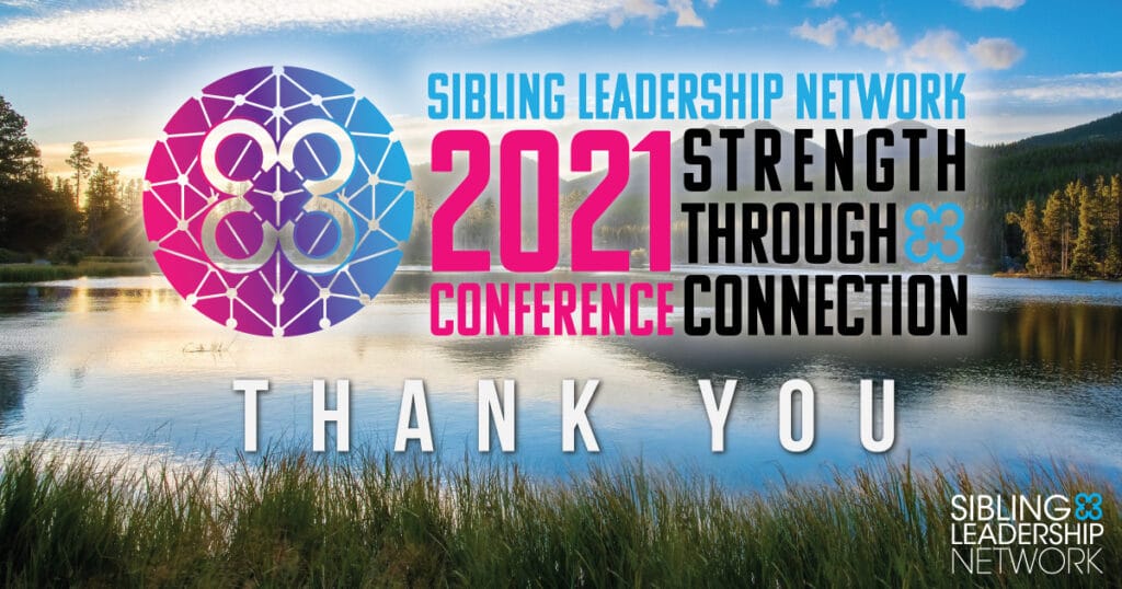 title card with conference logo infront of a sunset over a lake with mountains in the background and grass in the foreground