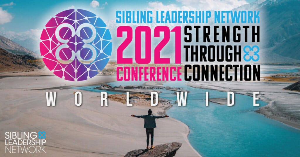 A man standing on a cliff, overlooking a desert and beautiful mountains, with the conference logo above