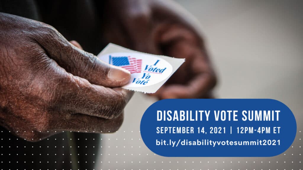 a close up of a hand holding an, "I voted" sticker