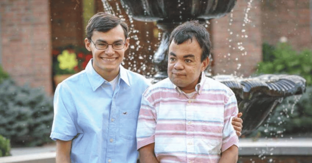 Two brothers sitting side by side